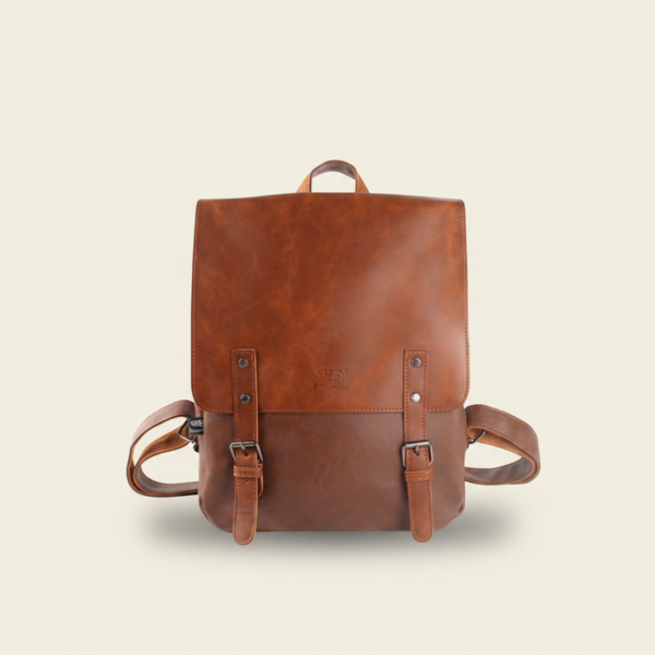 Light brown vegan PU leather travel laptop backpack, studio photograph on cream background
