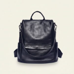 The Nomad convertible leather backpack in retro black on cream background
